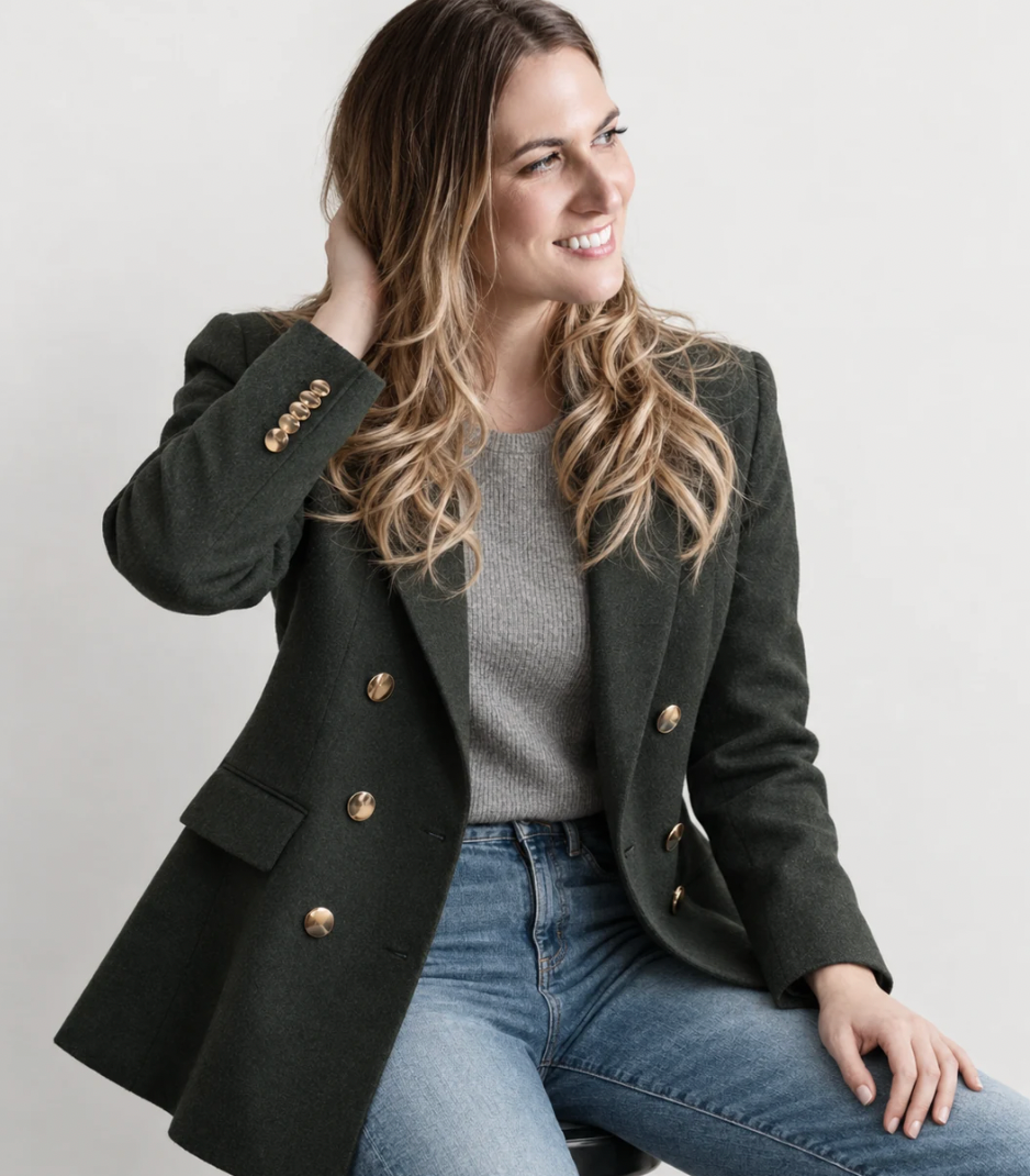 Dr. Michele Burklund, naturopathic physician, wearing a forest-green blazer